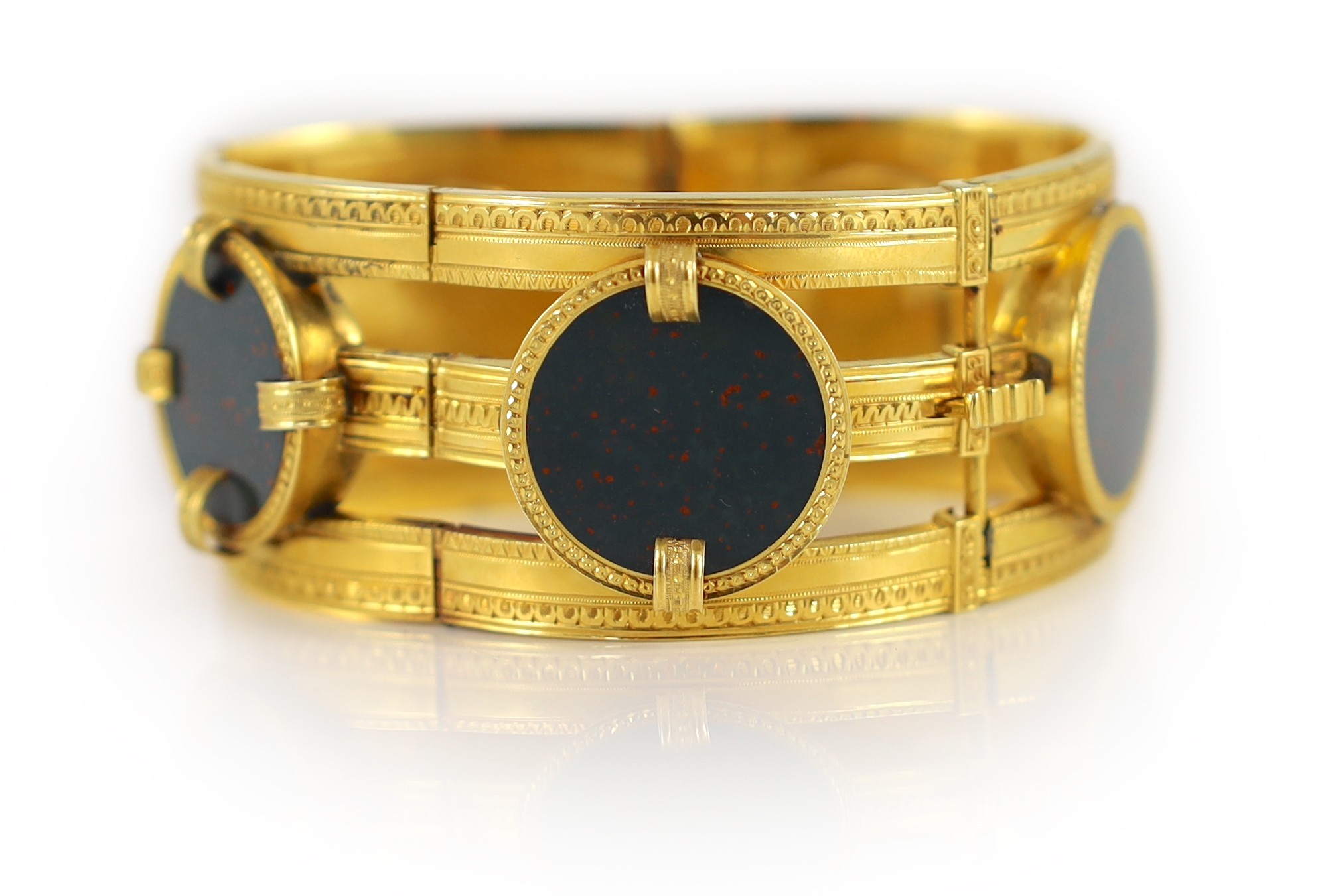 A 19th century French 18ct gold and five stone circular bloodstone set open work hinged bracelet